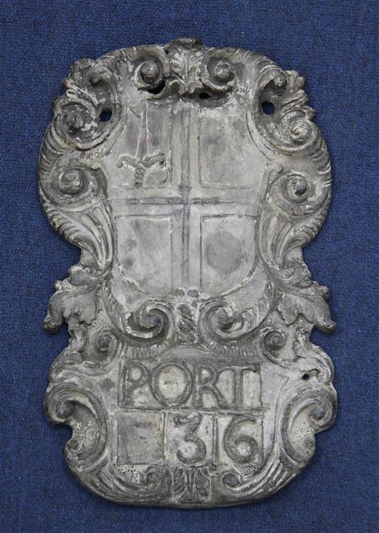 A late 17th century cartouche shape armorial wall plaque, 15.25 x 9.5in.